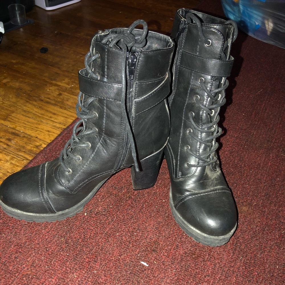 Heeled black strap boots